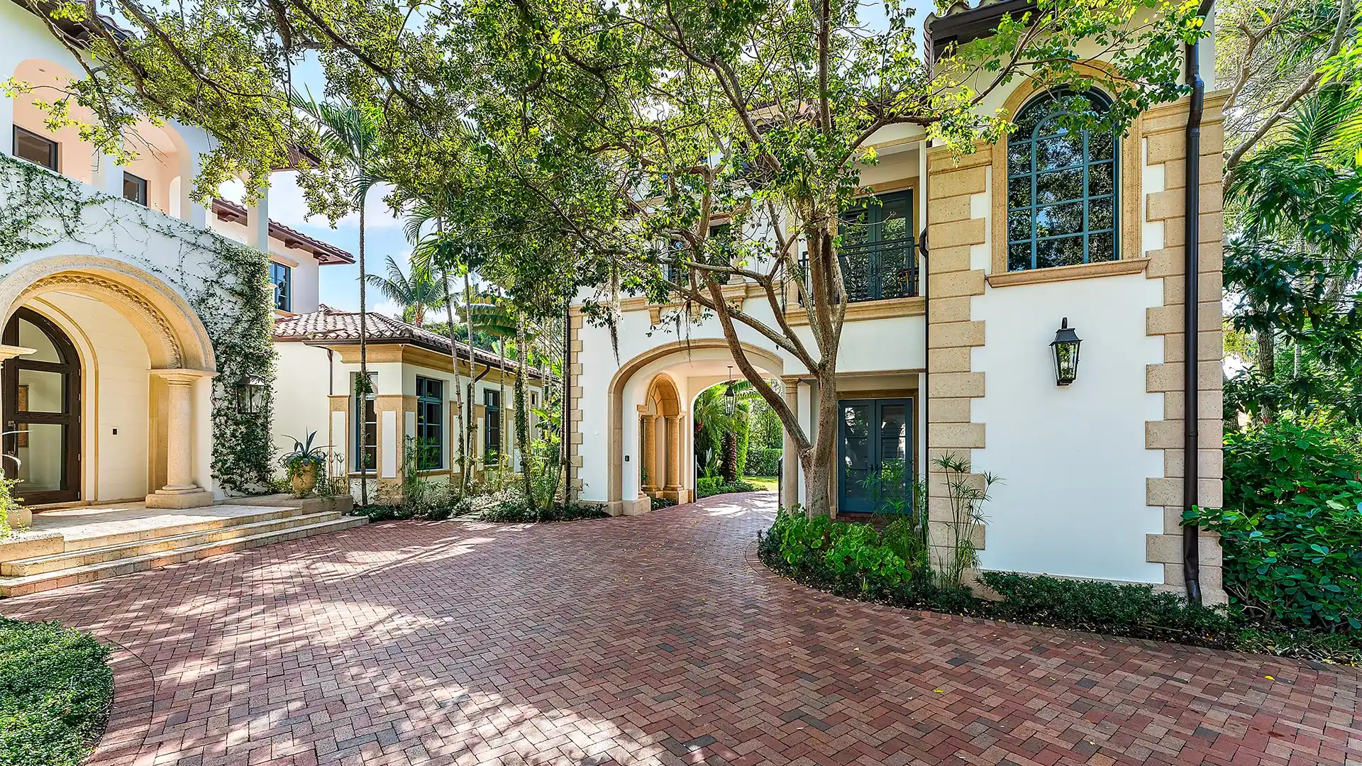 Charming New Mediterranean style home with a refined brick walkway, radiating elegance and welcoming you into its splendid embrace.