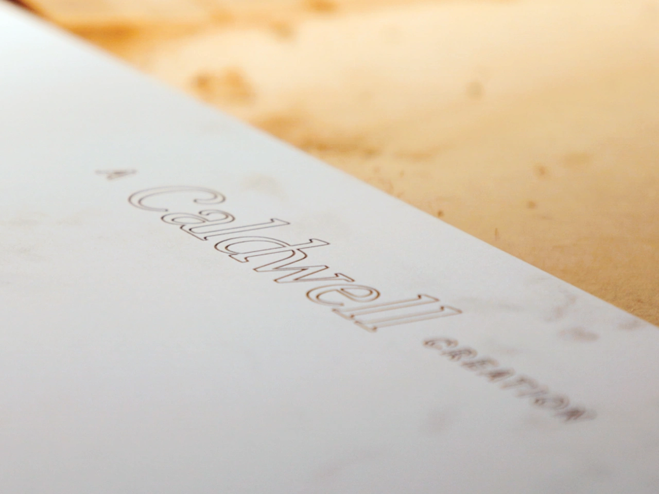 Piece of blueprint of furnishings with Caldwell logo visible.