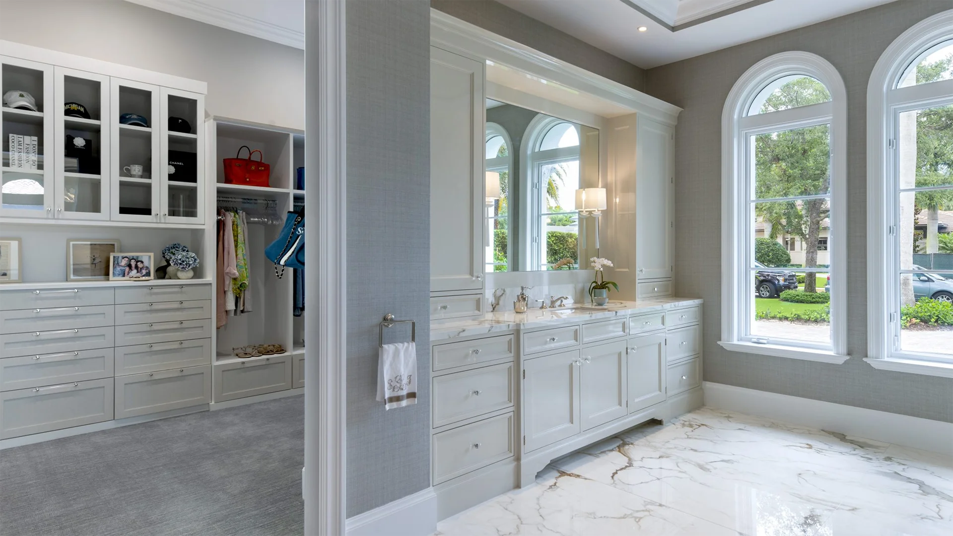 Modern bathroom that includes a large walk-in closet and a big window.