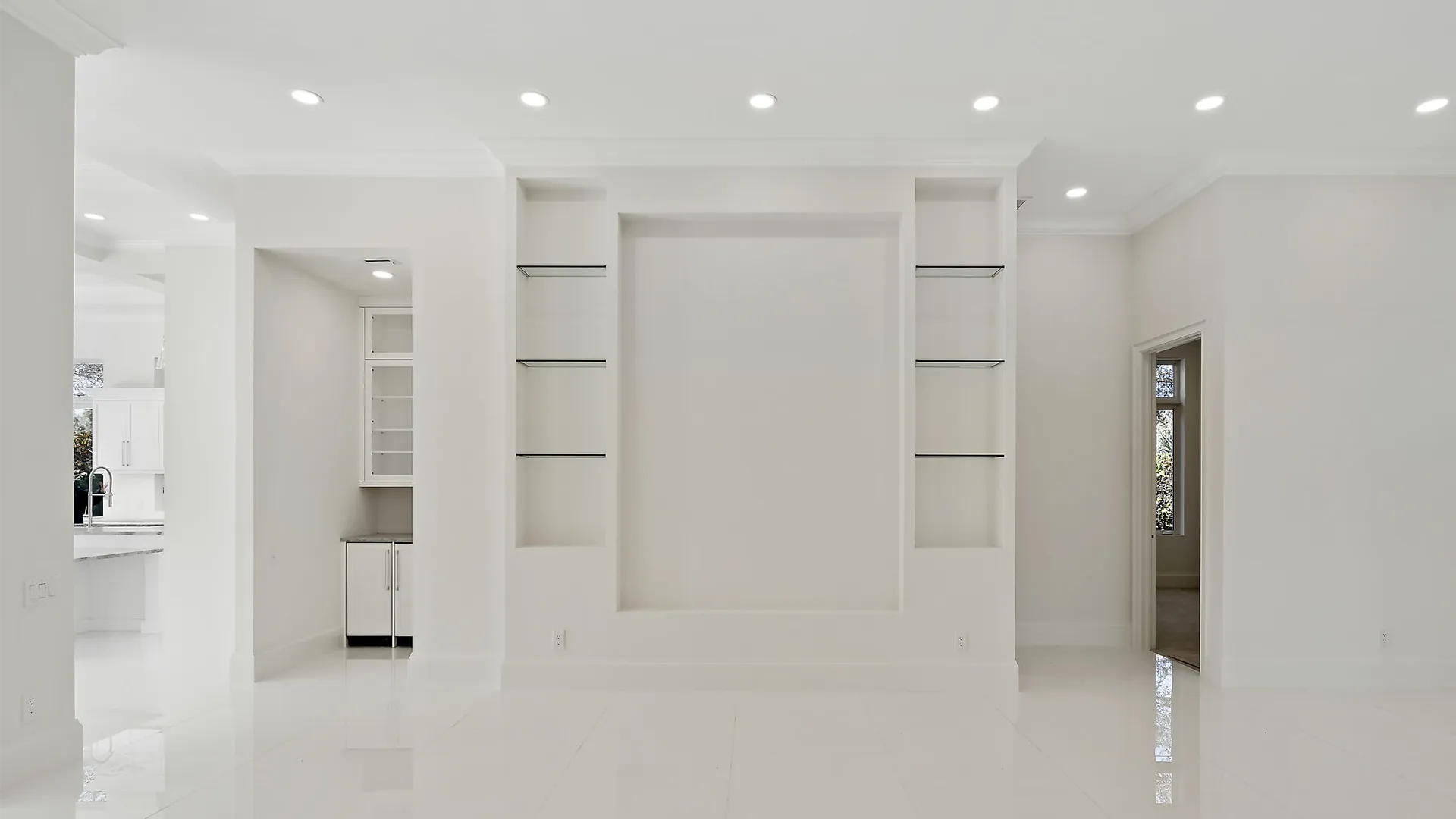 Serene white room featuring pristine white floors, furnishings and walls.