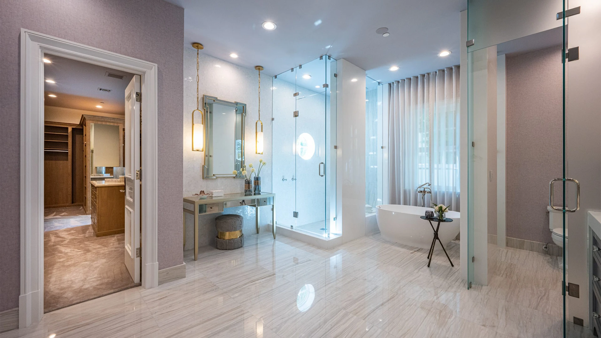 Remarkable bathroom showcasing a generous walk-in shower, vanity and an elegant tub.