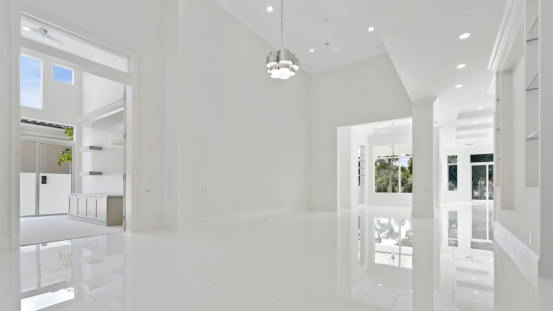 Refined white passageway showcasing a magnificent glass door.