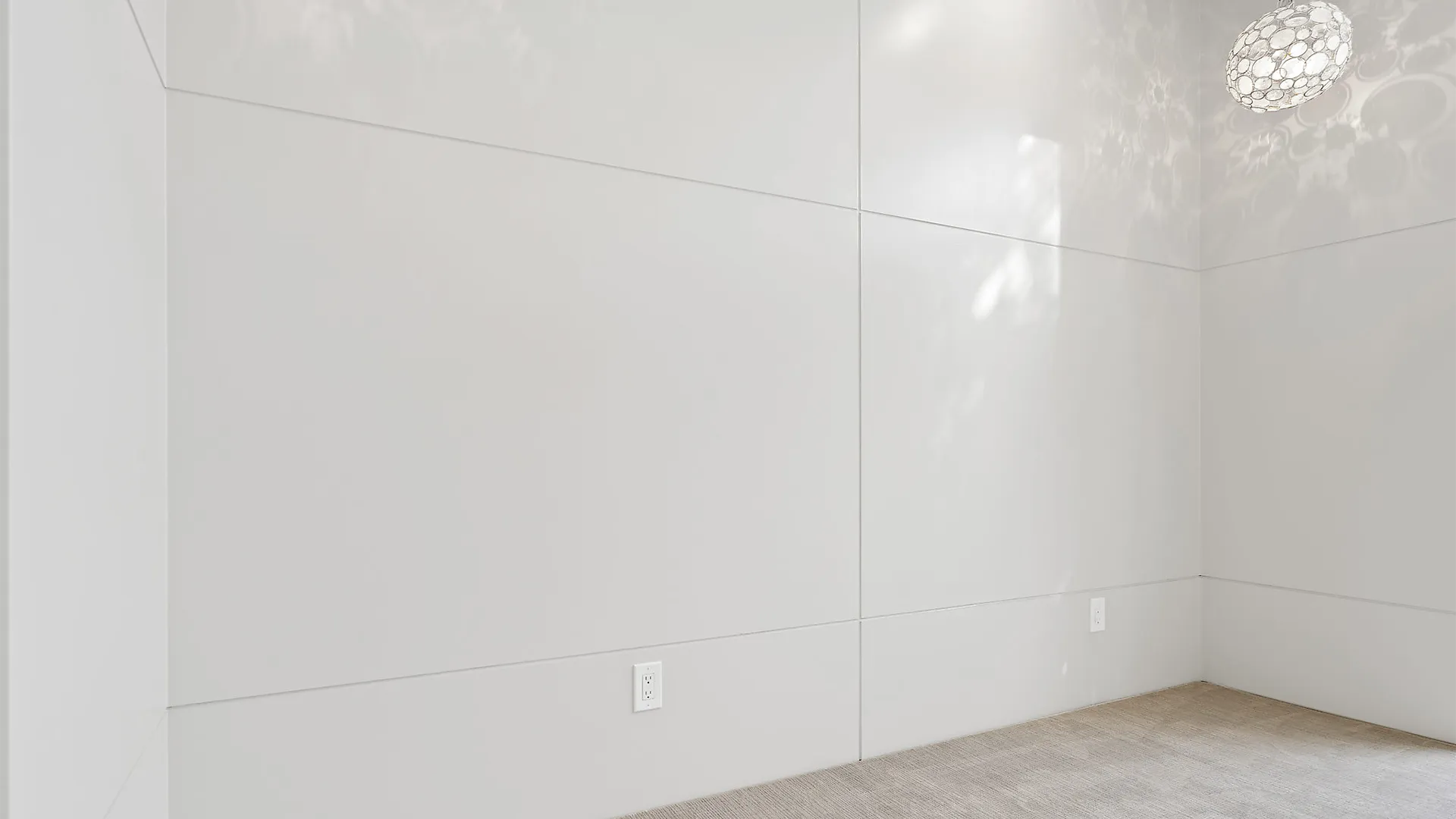 Immaculate white room with seamless white walls and a polished white floor.
