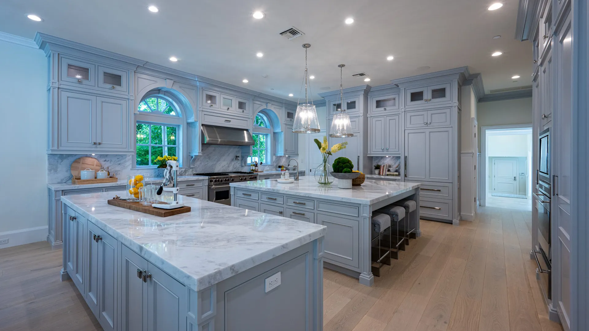 Kitchen with luxurious marble countertops and a spacious island.