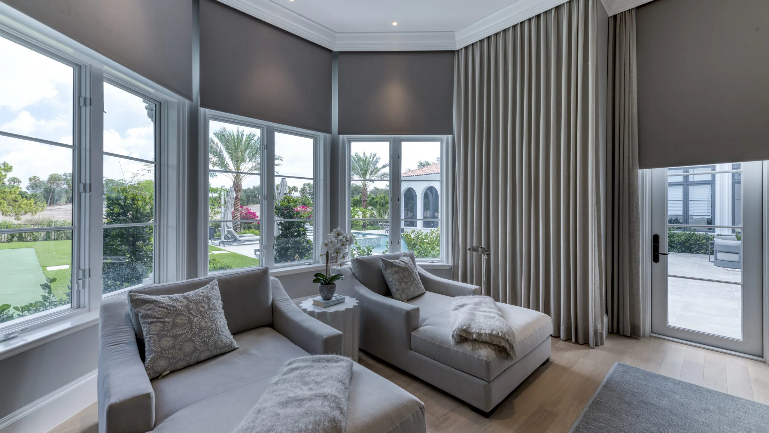Charming living room displaying two chairs adjacent to a window.