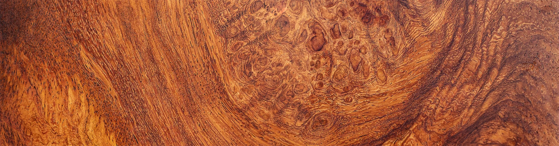Detailed close-up of a wooden surface showcasing its intricate natural patterns and textures.