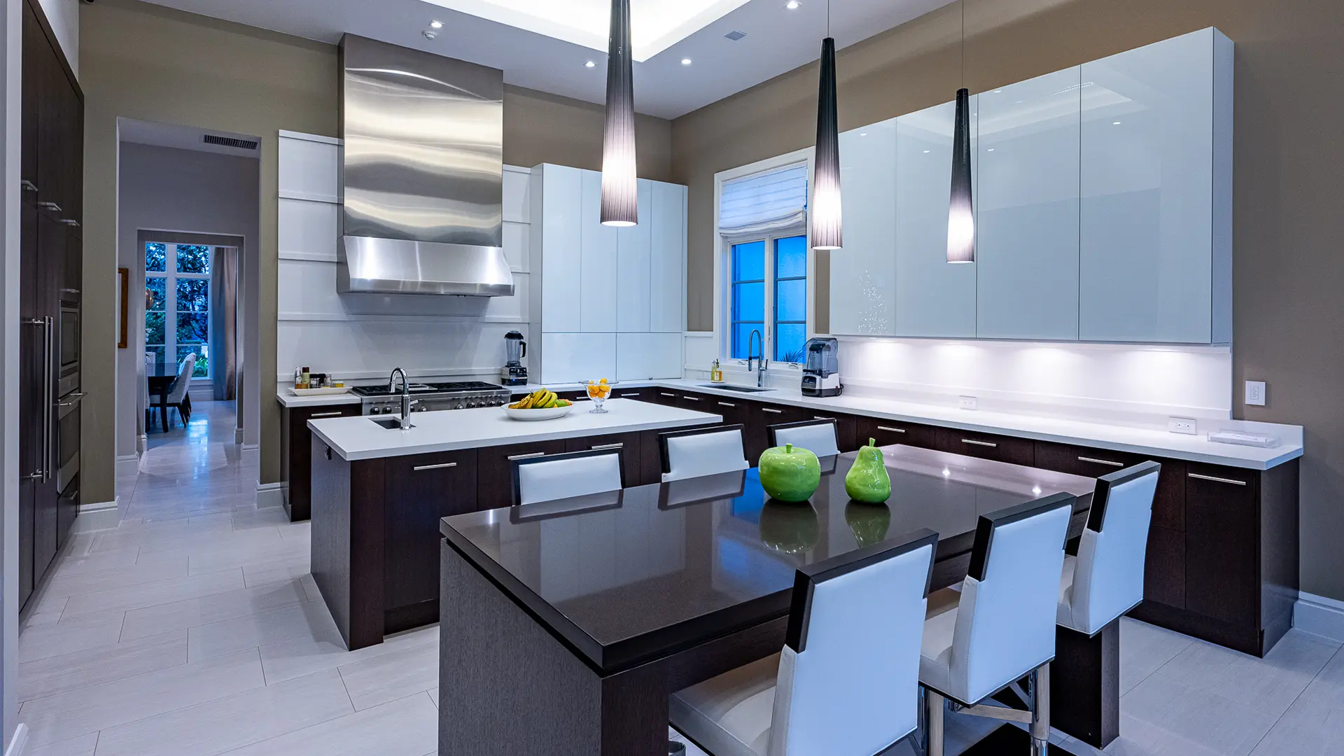 Kitchen design showcasing a generous island and pristine white cabinets.