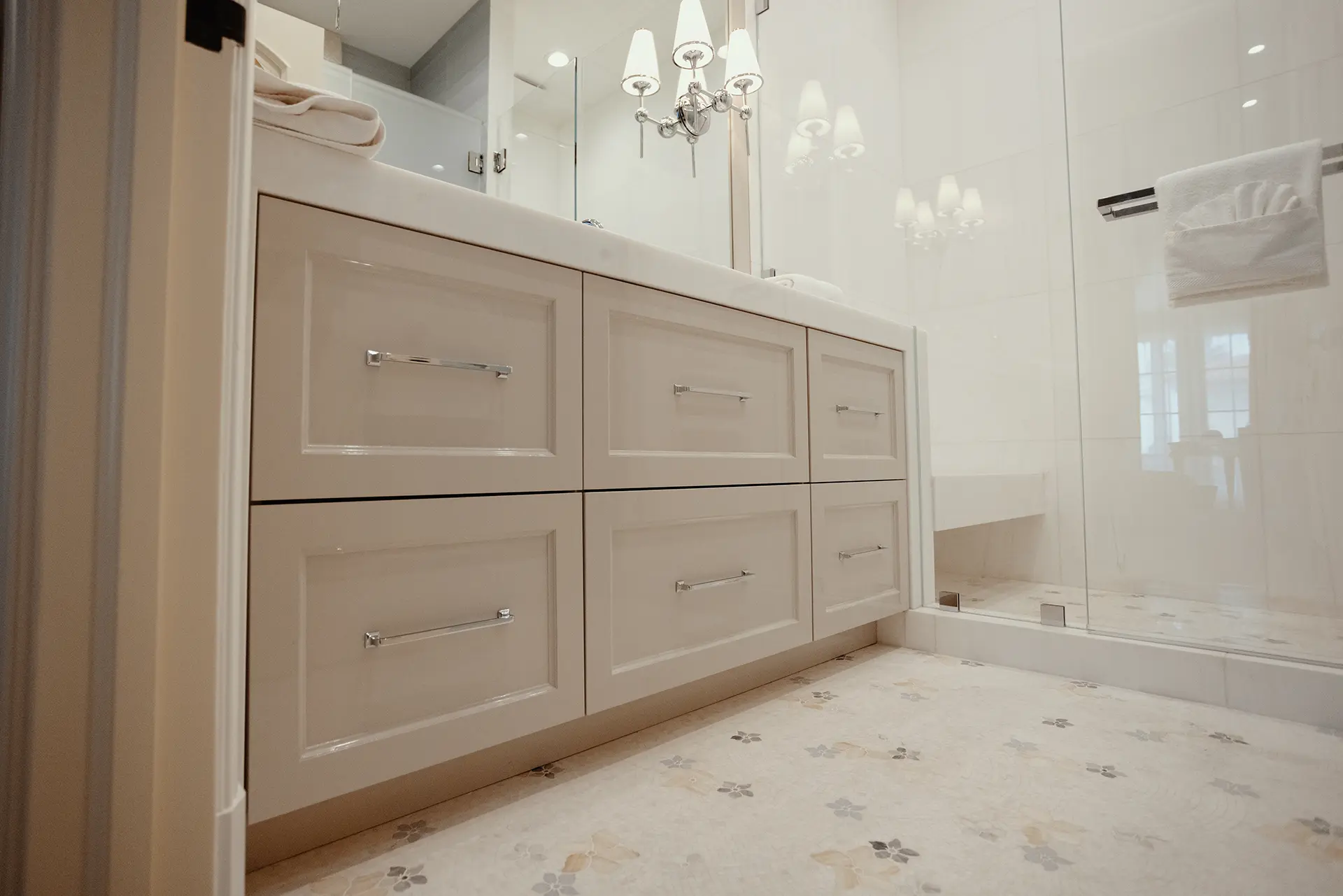 Elegant bathroom featuring High Gloss Lacquer Vanity in Alpaca, a shower, topped by a refined Polished White Diamond Marble and Honed Sakura Bianco Dolomiti Mosaic flooring