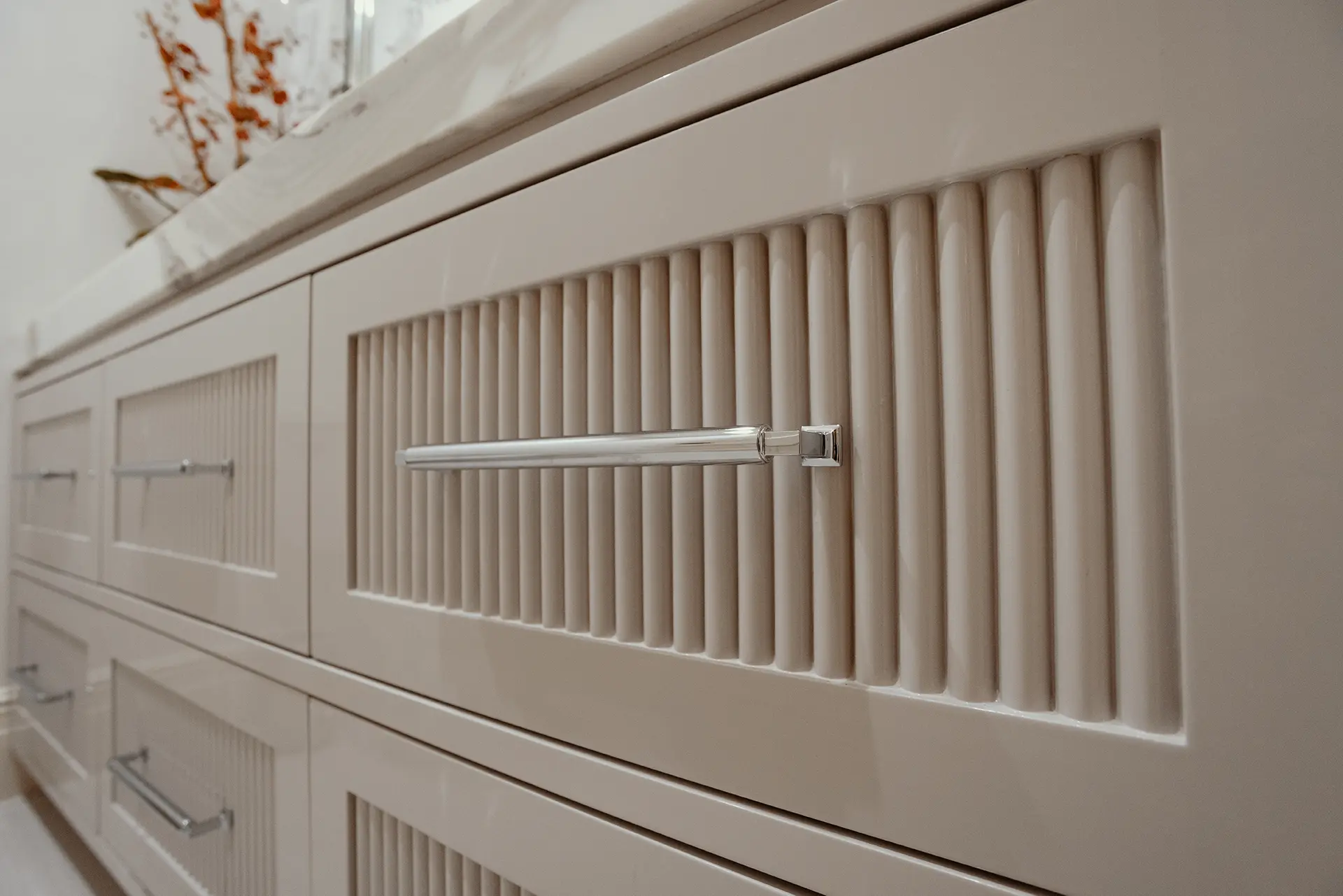 Close-up view of an Alpaca High Gloss Lacquer Vanity featuring custom ribbed drawer fronts that introduce visual interest and texture.